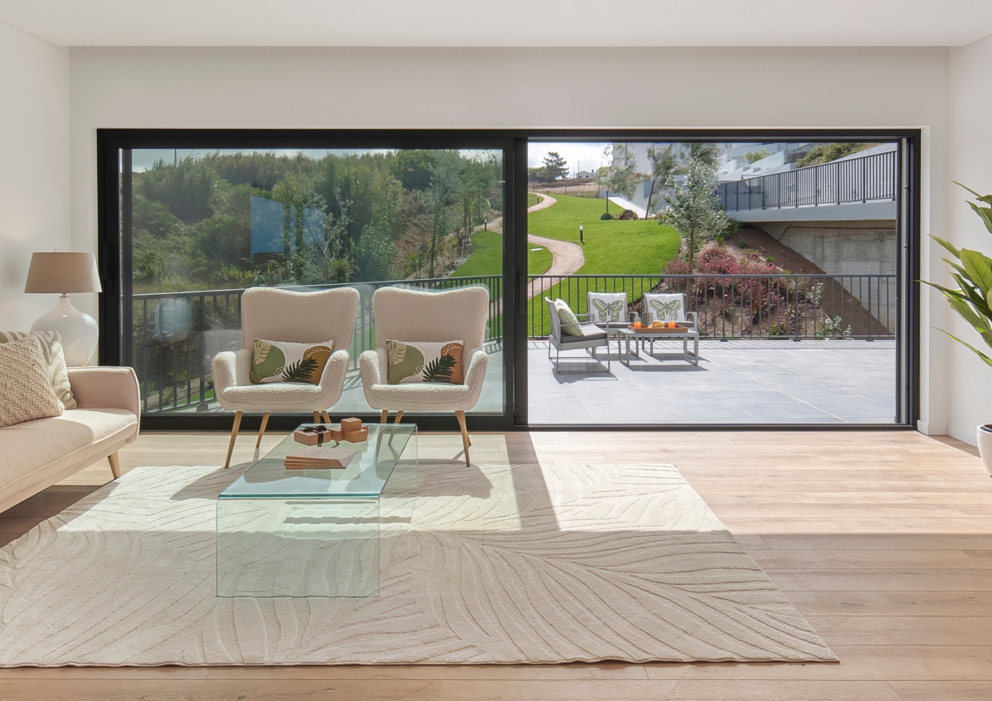 Modern white house with a pool surrounded by trees